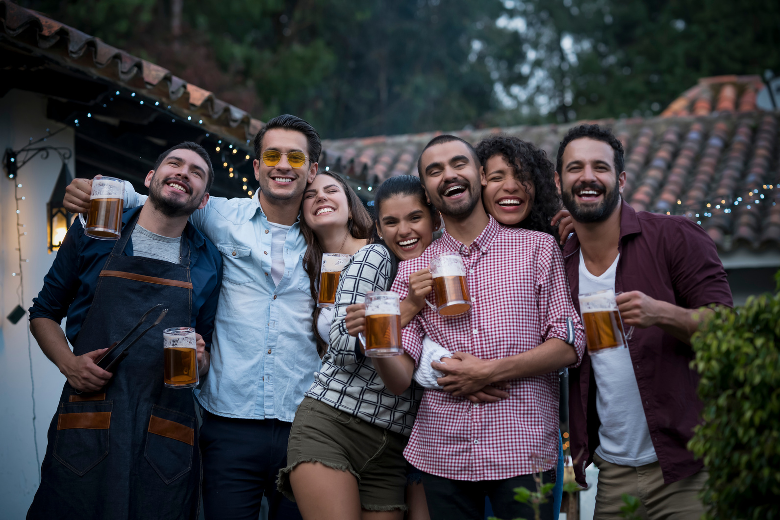Friends toasting in the barbecue